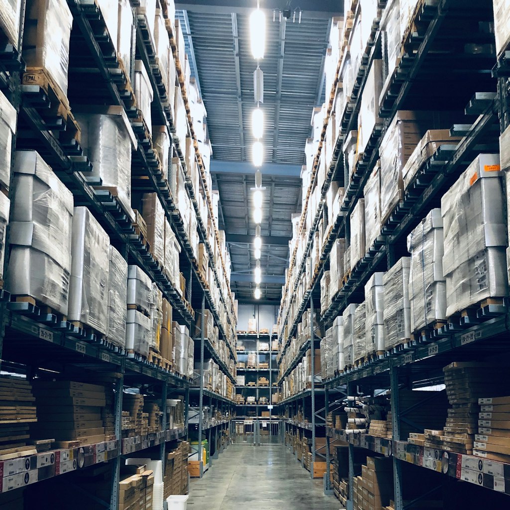 Warehouse aisle with stocked pallet racks